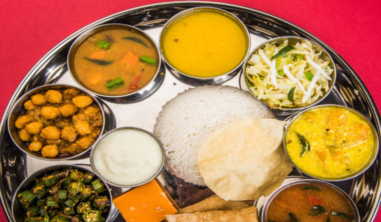 Treat your taste buds with a blend of spicy, tangy and sweet flavours of a Gujarati Thali