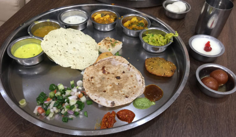It is about Dhoklas, Theplas, Undhiyu, Khadvi, Srikhand, Gujarati Dal, Khadi and Bhakris, it is about enjoying Gujarati food!